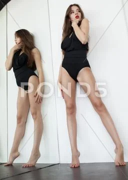 Pretty young brunette lady in a fashion pose Stock Photos