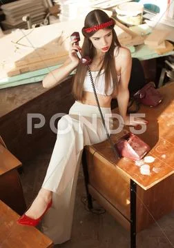 Pretty young brunette lady in a fashion pose Stock Photos