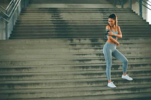 Pretty young emale runner resting Stock Photos