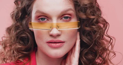 Pretty Young female Model demonstrating creative Eyeglasses, Looking Stylish and Stock Footage 126157014