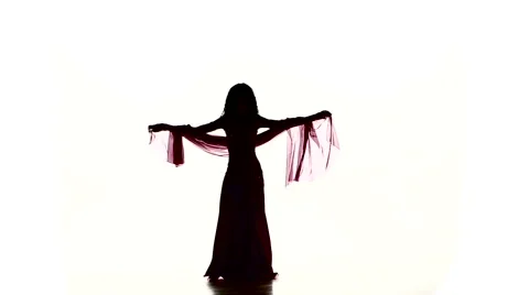 Pretty young girl continue dancing belly dance with colored shawl, on white Video stock 61094460
