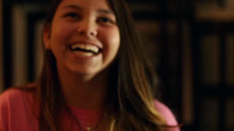 Pretty young girl laughing and sticking ... | Stock Video