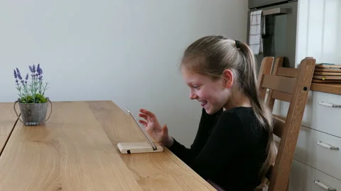 Pretty Young Girl Using A Smartphone In The Kitchen, Smiling. Stock Footage 90803181