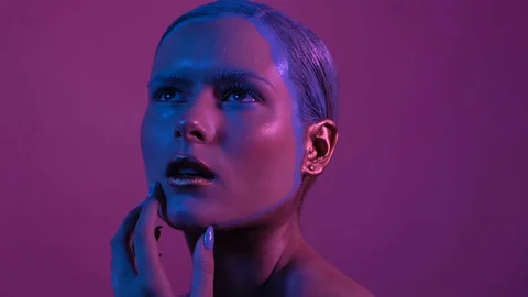 Pretty young model looks into camera and touches her lip Stock Footage 130128070