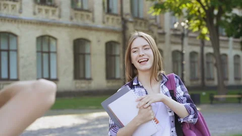Pretty young mosel posing like a student. Photographer taking photos. Video stock 115110629