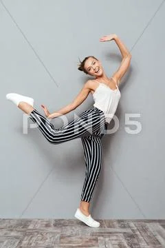 Pretty young smiling girl making fun isolated Stock Photos