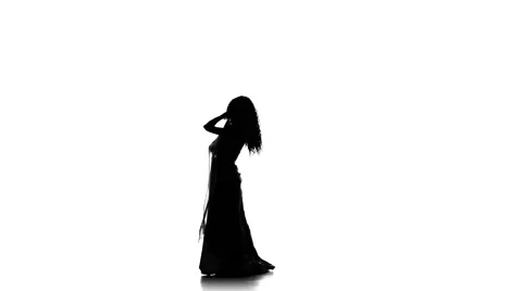 Pretty young woman continue dancing belly dance with shawl, sihouette, on white Video stock 61093924