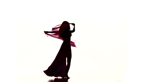 Pretty young woman continue dancing belly dance with colored shawl, on white Video stock 61094403
