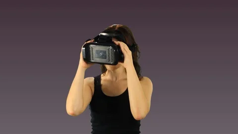 Pretty young woman testing VR headset. Stock Footage 101346441