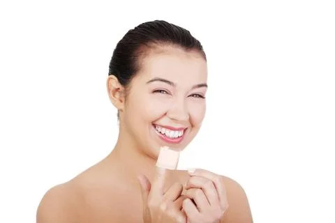Pretty young woman using adhesive plaster. Pretty young woman using adhesi... Stock Photos