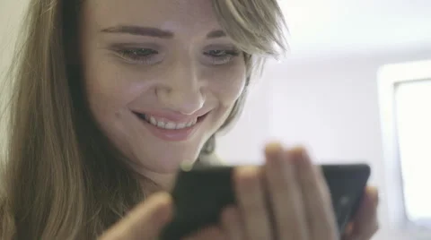 Pretty young woman using mobile phone. 動画素材 49745982