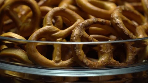 Pretzel salted in rotation. Close up. Studio shot. Stock Footage 102627505