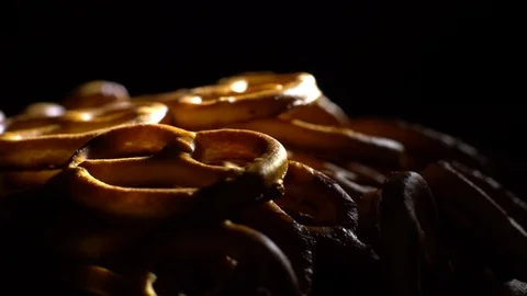 Pretzel salted in rotation. Close up. Studio shot. Black background. Stock Footage 102627714