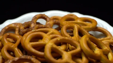 Pretzel salted in rotation. Close up. Studio shot. Black background. 動画素材 102664843
