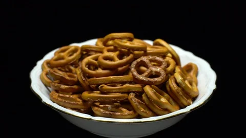 Pretzel salted in rotation. Close up. Studio shot. Black background. Stock Footage 102664906