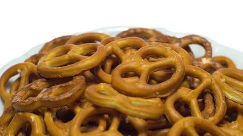 Pretzel salted in rotation. Close up. Studio shot. isolated on white. Video stock 102668658