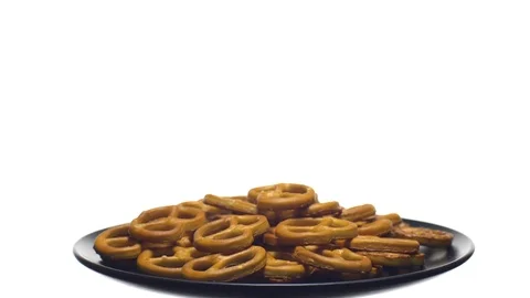 Pretzel salted in rotation. Close up. Studio shot. isolated on white. Stock Footage 102677836