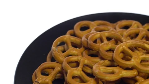 Pretzel salted in rotation. Close up. Studio shot. isolated on white. Stock Footage 102678574
