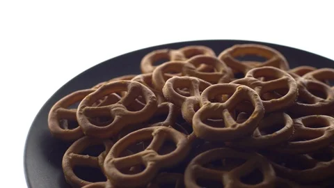 Pretzel salted in rotation. Close up. Studio shot. isolated on white. Stock Footage 102678590
