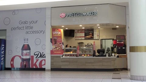 Pretzelmaker snack stand employees prepare for next customers Video stock 256048580