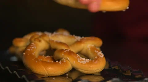 Pretzels Being Fixed and Placed On Plate HD Video Stock Footage 26279336
