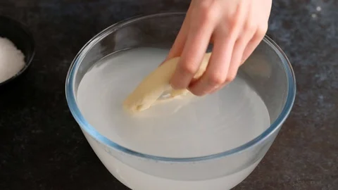 Pretzels cooked in soda solution. Oktoberfest food menu, soft pretzels and beer Stock Footage 129776777
