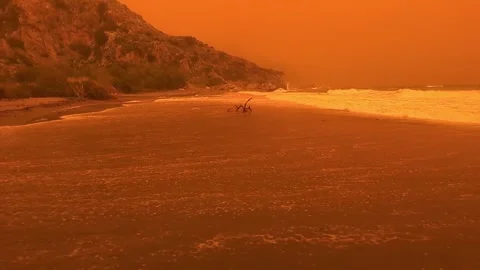 Preveli beach during red dust storm erminio crete greece Stock Footage 333070567