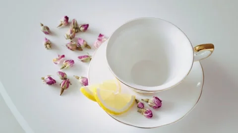 Prevent sugar white cup with lemon and roses Stock Footage 55872270