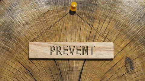 Prevent word. Background log written on wooden frame Stock Photos