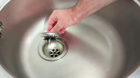 Preventing Clogs: Sink Strainer Positioned Over Drain Hole 스톡 동영상 319737413