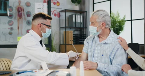 Prevention from covid-19 where attractive confident skilled doctor in face mask Stock Footage 160796835