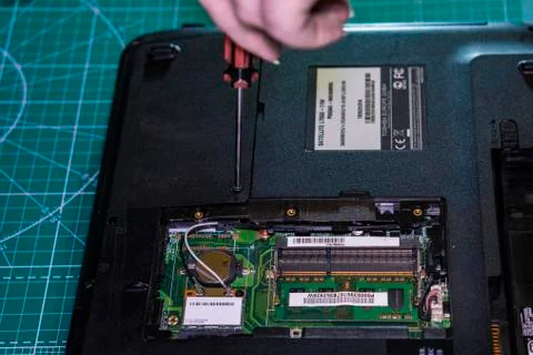 Preventive work with household appliances. Laptop repair. Stockfoto's