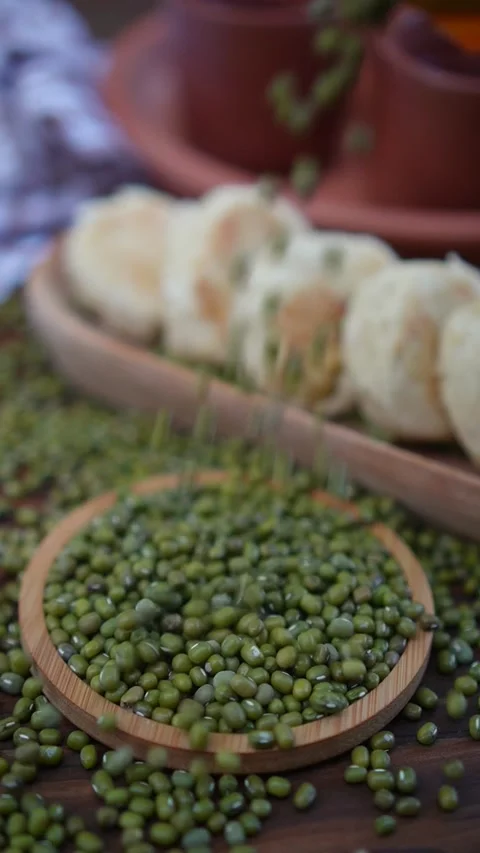 Preview of mung bean cake named bakpia among mung beans on the wood table Stock Footage 283541967