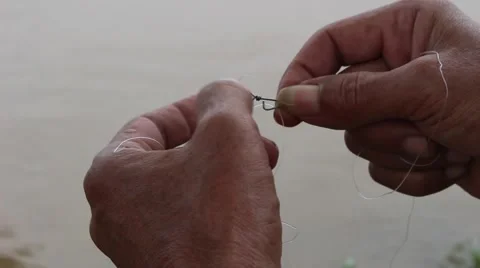 Prey fish hooks, the man sitting by the river fishing Stock Footage 58201636