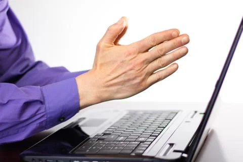 Preying Hands in front of Laptop Computer Display Screen 写真素材