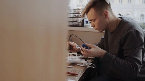 Prfessional is working on a drone with a soldering iron Video stock 86568113