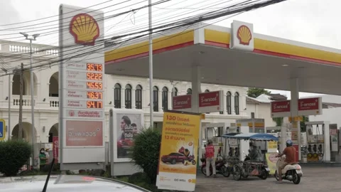 Price chart of Shell petrol gas station in phuket old town while gas price ri Stock Footage 201737527