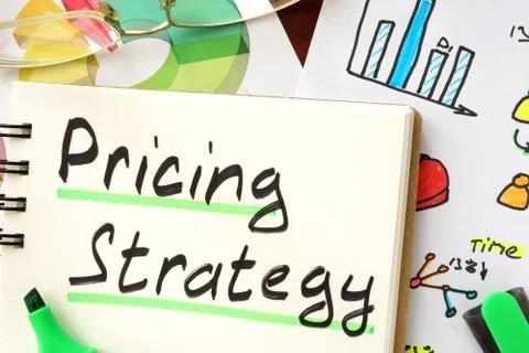 Pricing strategy sign written in a notepad. Stock Photos