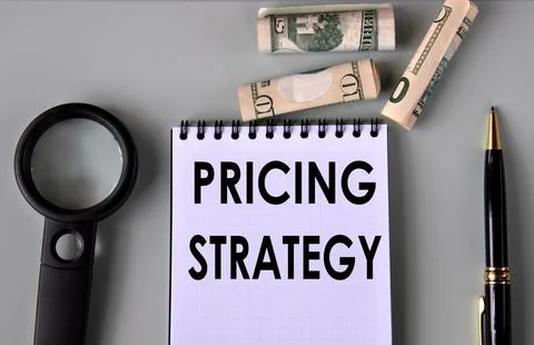 PRICING STRATEGY - words in a notebook against the background of a pen, mag.. Stock Photos