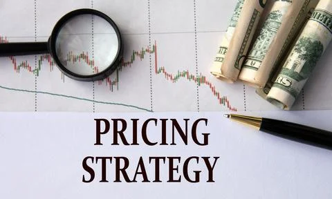 PRICING STRATEGY - words on a white sheet against the background of a chart.. Stock Photos