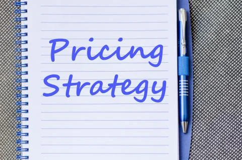 Pricing strategy write on notebook Stock Photos