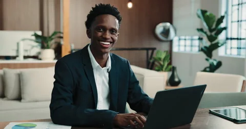 Pride, face or black man in agency with laptop, finance consultant or confidence Stock Footage 346197937