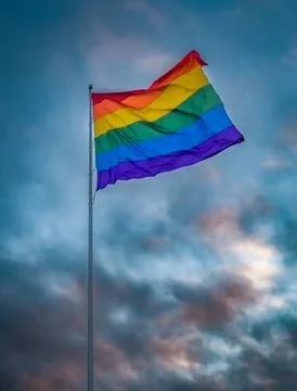 Pride flag with dramatic sunset sky, Castro District, San Francisco, California Stock Photos