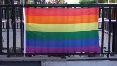 The pride flag is moving a little from the effect of the wind. The street Stock Footage 118197293