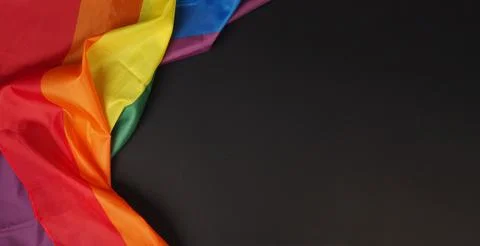 Pride flag or Rainbow flag isolated on black background.. Stock Photos
