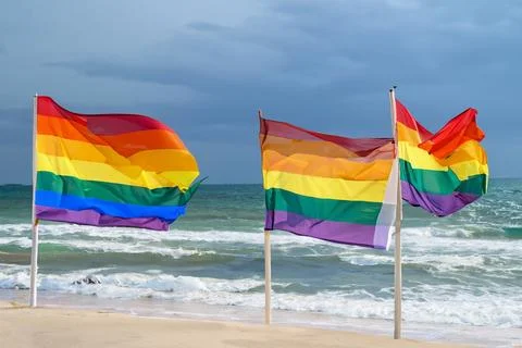 Pride flags at the beach in Bintan due to rough waves and storms Stock Photos