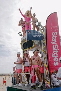 Pride float with cheering participants at Sitges Pride Parade, Spain Stock Photos