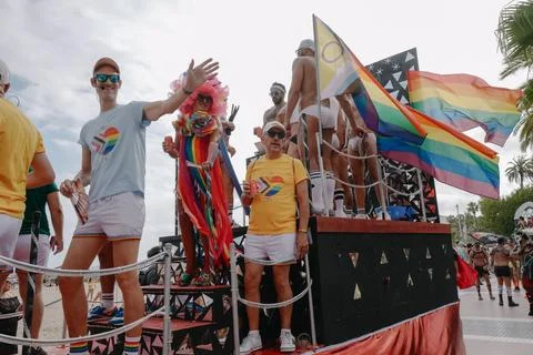 Pride float with cheering participants at Sitges Pride Parade, Spain Stock Photos