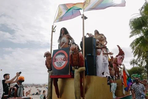 Pride float with cheering participants at Sitges Pride Parade, Spain Stock Photos