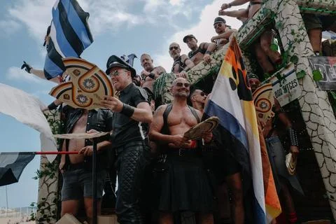 Pride float with cheering participants at Sitges Pride Parade, Spain Stock Photos